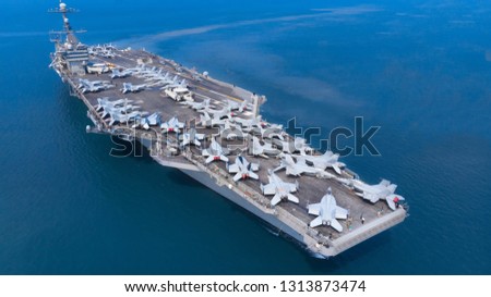 Nuclear ship, Military navy ship carrier full loading fighter jet aircraft for prepare troops USA VS Iran. Royalty-Free Stock Photo #1313873474