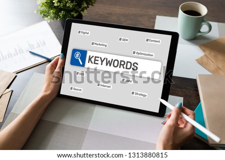 Keywords. SEO, Search engine optimization and internet marketing concept on screen. Royalty-Free Stock Photo #1313880815