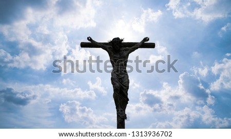 Silhouette of Jesus Christ crucifix cross on heaven
