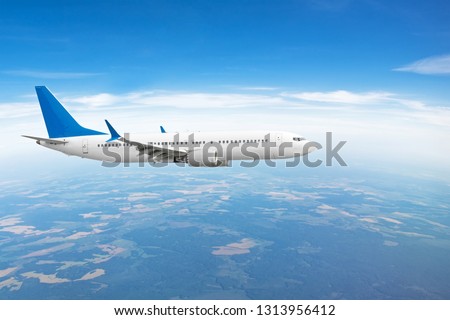 Airplane flies in the sky, the earth is sphere. Royalty-Free Stock Photo #1313956412