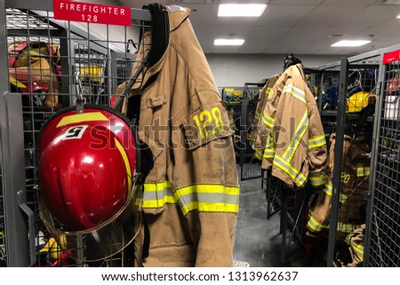 Firefighter coat and helmet in locker room