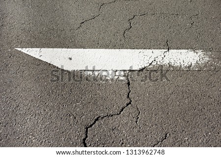 Deteriorated road signs and  crack of the road surface                         