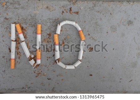 No smoking sign made with broken cigarettes
