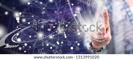 Woman touching a virtual technology concept on a touch screen with her finger
