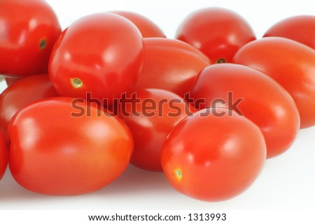 Baby plum tomatoes on white background. Royalty-Free Stock Photo #1313993
