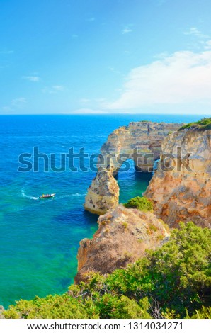 Beautiful summer landscape of portuguese coast in Algarve region, close to city Lagoa. This part of Portugal offers amazing sea caves and cliffs in picturesque bays of the Atlantic Ocean. 