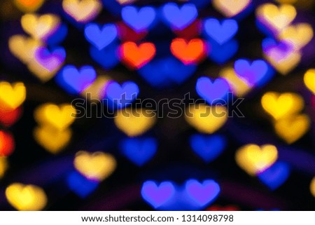 Multicolored hearts bokeh background