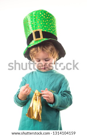 St Patrick's Day. Patrick boy. Child in green hat holds pot with gold. Green top hat. Leprechaun. Green leprechaun. Green hat with clover. Traditions of Saint Patrick Day. Sale. Discount. March.