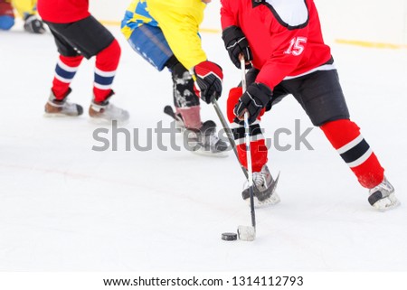 Hockey player counterattack in hockey game. Winter sport background