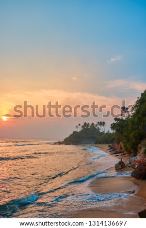 Beautiful view of the beach at sunset. Midigama. Sri-Lanka. Acid Beach. Summer.