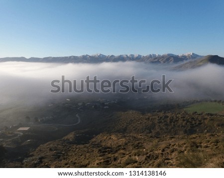 Snow in the mountains and fog in the depressions Pictures of the mountains of eastern Algeria