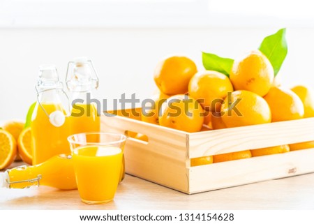 Fresh orange juice for drink in glass on wooden table - Healthy food concept