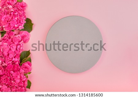 Beautiful floral background and green leaves, texture, wallpaper. Flat-lay of pink hydrangea on rose background, top view, copy space greeting card