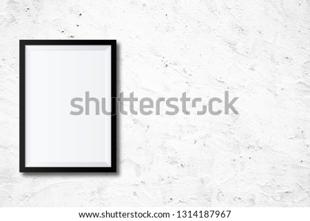 White poster Or a white picture frame hanging on the brick wall background in the room.Have space for your message.