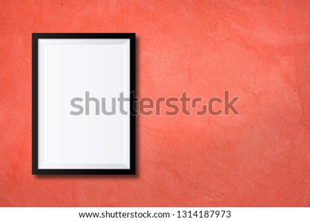 White poster or a white picture frame hanging on the brick wall background in the room.Have space for your message.