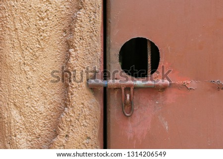 Close-up metal door latch with locked.