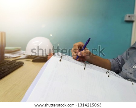 Engineer inspecting and checking datasheet.Engineers check the preventive maintenance documents after the operation.  Royalty-Free Stock Photo #1314215063