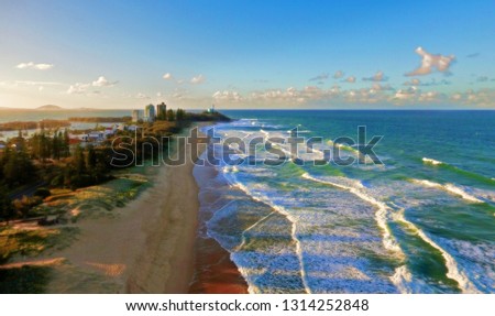 Beautiful Scene of the Sunshine Coast at Sunset with Waves Rolling In