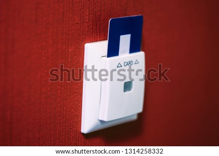 Closeup of hotel room door and lights electronic card in the wall Selected focus