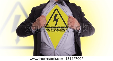 Businessman rips open his shirt to show his high voltage symbol t-shirt