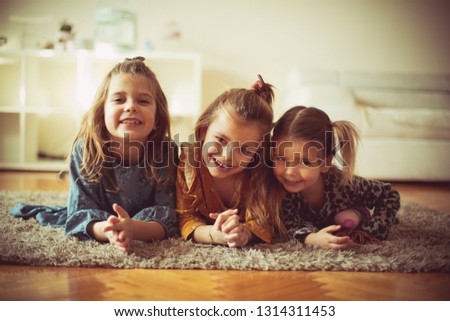  Sisters are best friends. Three little girls at home.
 