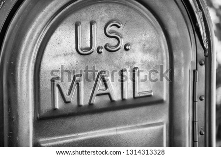US Mail written on a mailbox. Royalty-Free Stock Photo #1314313328