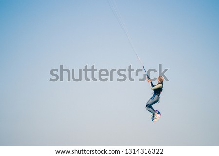Picture of a Kite surfer performing difficult tricks in high winds. Extrme sports shot in Tarifa, Andalusia, Spain