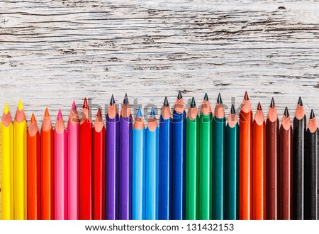 Assortment of coloured pencils in row