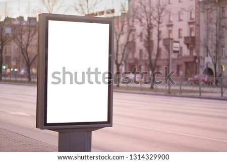 vertical billboard for posters, city format, illuminated sign near the road outdoor advertising