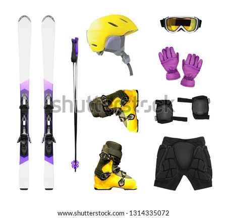 Ski equipment and accessories isolated on white background. Ski boots, helmet, gloves, etc. Royalty-Free Stock Photo #1314335072