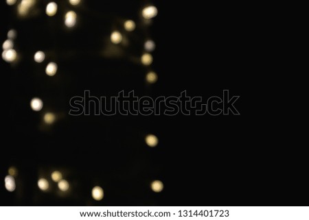 Golden bokeh lights and green trees, blur