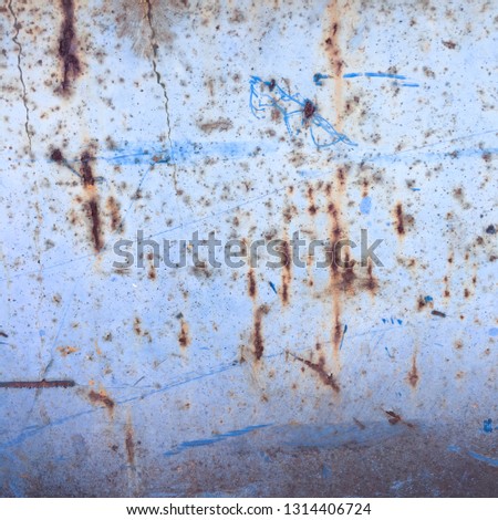 
Iron surface detail in blue colors with stains of rusty red