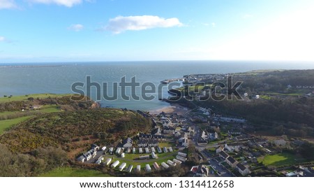 Stunning aerial picture overlooking Dunmore East, Ireland. Dunmore East is a popular tourist and fishing village in County Waterford, Ireland. Situated on the west side of Waterford Harbour.