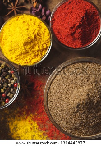 Ground Black Pepper. Place for text. Different types of Spices in a bowl on a stone background. The view from the top