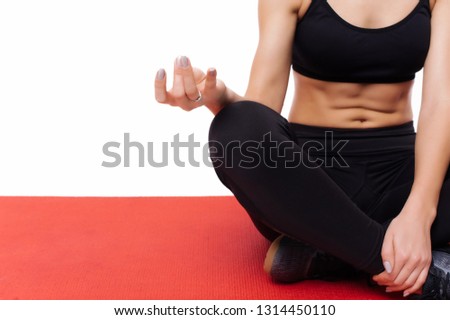 Close up woman on yoga mat to relax, practicing yoga at studio
