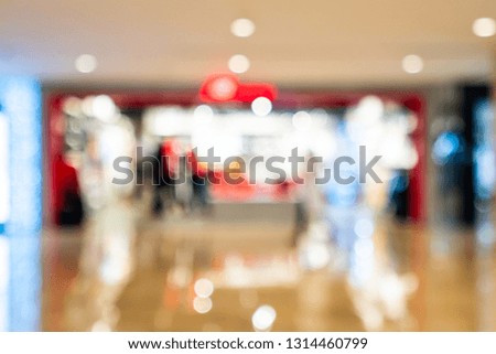 Abstract blur boutique fashion display window with mannequins in shopping mall