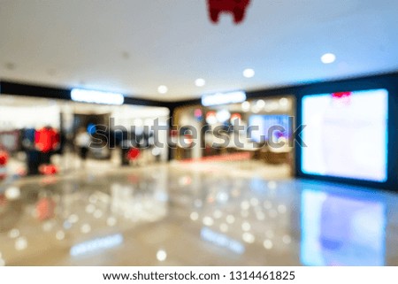 Abstract blur boutique fashion display window with mannequins in shopping mall