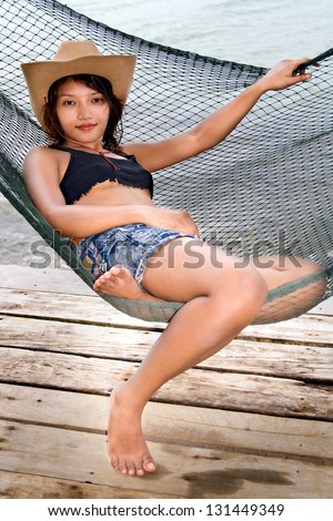 woman resting on a hammock
