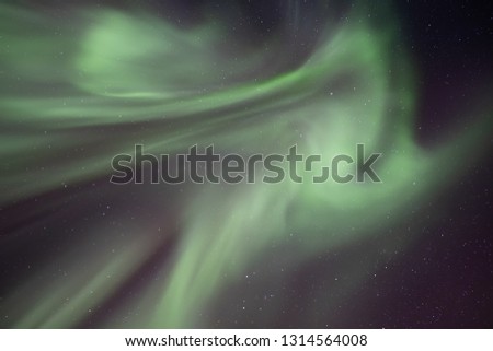 Aurora Borealis-The Northern Lights in Iceland high in the sky. The amazing natural wonder of the world