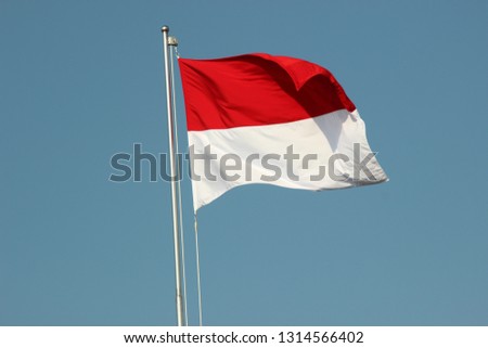 INDONESIA FLAG ON BLUE SKY