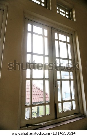 Old window and broken windows with a view looking outside. - Image