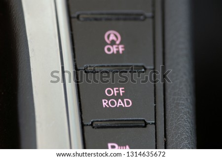 button to activate the off-road performance of the car