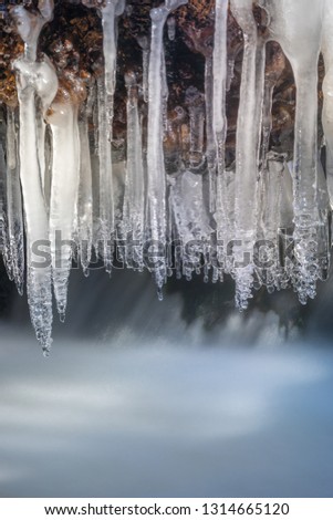 Icicles on a river - Image