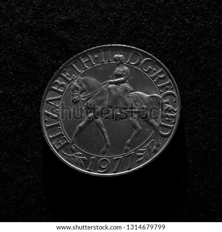 Commemorative twenty-five pence cupronickel coin issued for the Silver Jubilee in 1977, designed by Arnold Machin.