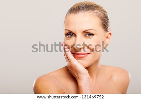 modern senior woman with hand on her face Royalty-Free Stock Photo #131469752