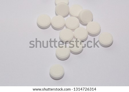 Aspirin tablets on a white background