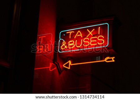Neon taxi & buses sign