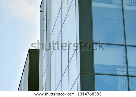 Blue clean glass wall of modern office building