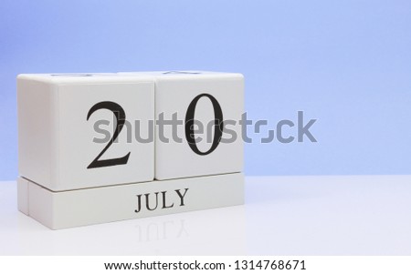 July 20st. Day 20 of month, daily calendar on white table with reflection, with light blue background. Summer time, empty space for text