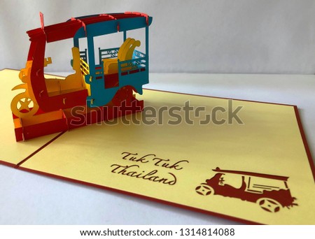 Colorful pop up paper card cream color Thailand art signature type of car made by red blue yellow color